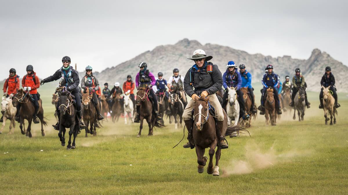 Queensland's Will Comiskey, centre, leads the field out at the start of the 2017 Mongol Derby.