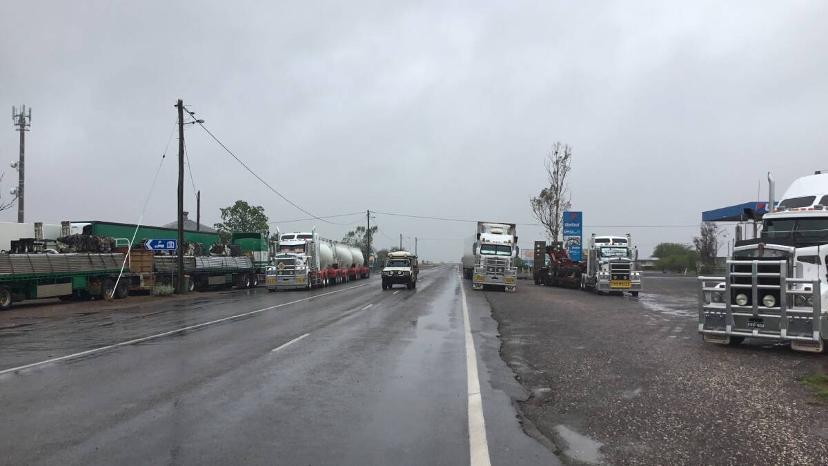 The crowded Landsborough Highway scene at McKinlay as trucks and travellers wait out the flooding in comfort at the Walkabout Creek Hotel. Photos by Kelly Wust.