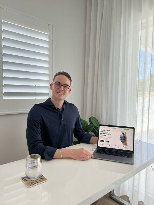 Cairns local Josh Fidrmuc with his app that provides pet owners with on-demand video consultations at any time of day or night. Picture: Supplied
