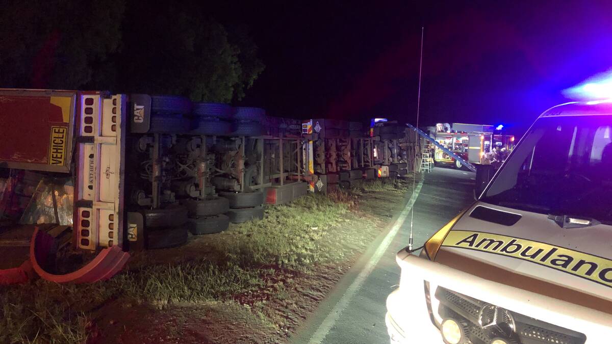 The driver of the road train was pinned inside until a passer-by arrived. Pictures supplied by RACQ Capricorn Rescue.