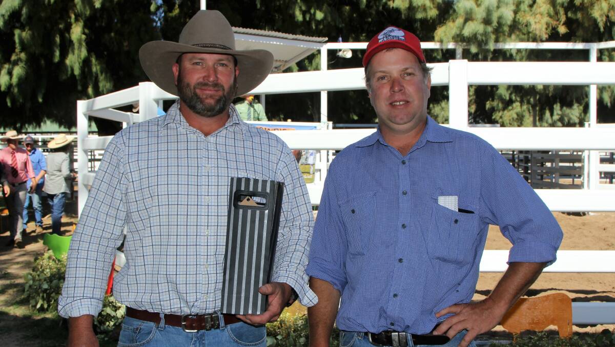 Blackall's Danny and Murray Allan, Erne Station, with the traditional prize given by the Mobbs family to the top volume buyers of the Gowrie sale.