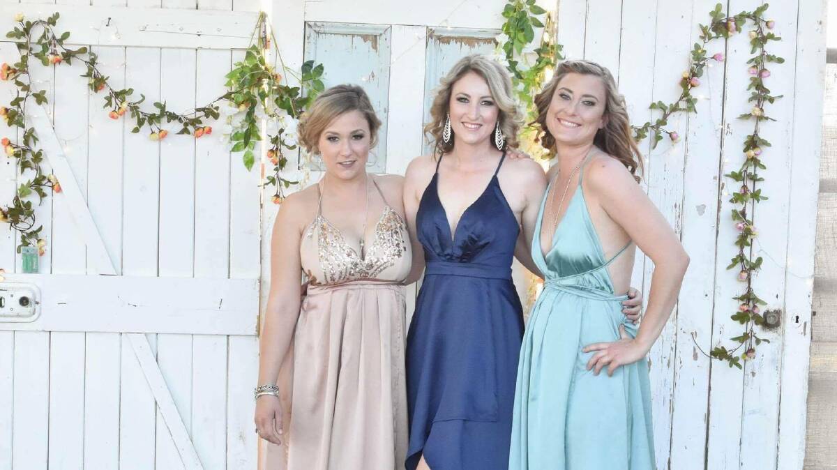 Demi Keating, Rachel Atkinson and Lacee Marquis had their boots and bling on for a night of kicking up their heels. Photos by Cassilis Photography.