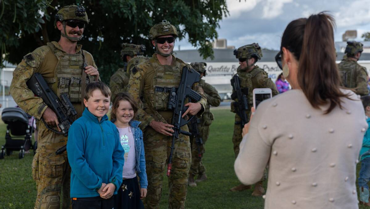 Australian Army soldiers from 3rd Battalion, Royal Australian Regiment meet with Charters Towers locals at the Exercise Brolga Run 2022 community event. Picture: Gregory Scott