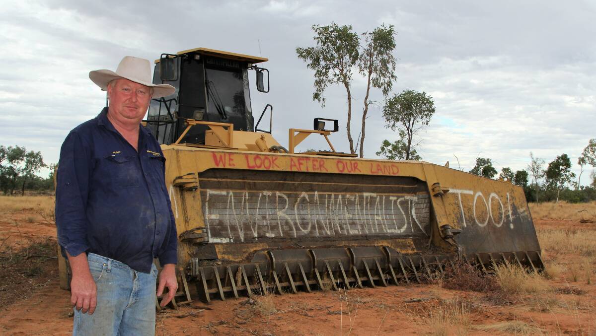 Scott Murray and the wheeled dozer with its environmental message used on Green Shirt Day on May 1.