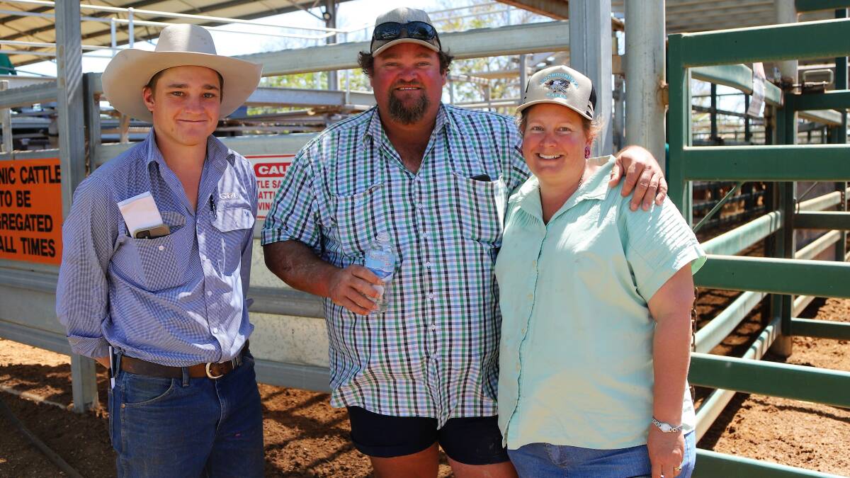 Sterling George, GDL Blackall with Carl and Rowena Angus, Glenariff, Prairie, who were on hand to see their weaners sold at Blackall. Pictures: Sally Gall