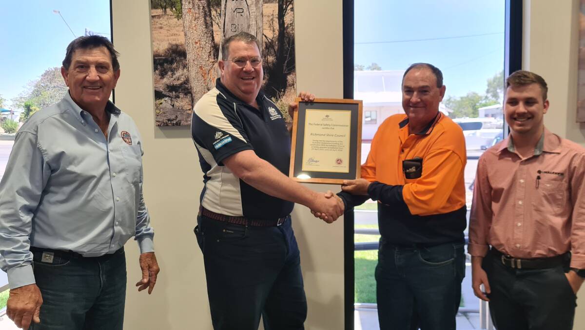 Richmond Shire mayor John Wharton is all smiles as Assistant Minister Scott Buchholz presents the accreditation certificate to shire staff members. Photo supplied.