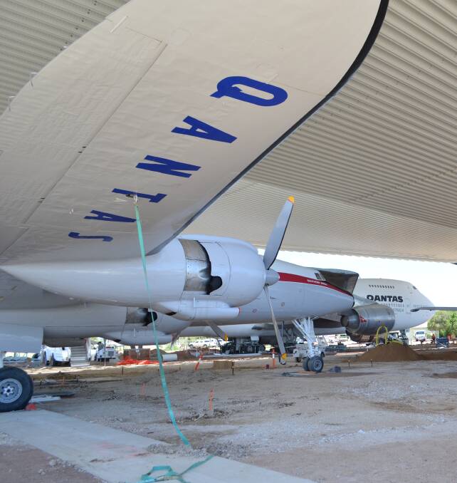 The Super Constellation takes up its position under the Qantas Founders Outback Museum airpark roof. Pictures - Supplied.