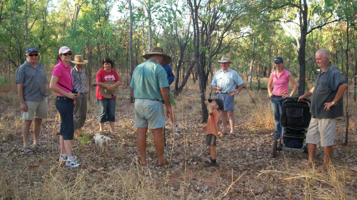 A holistic management training group discussing ecosystem functions in a
paddock at Coodardie, Mataranka, NT late in the dry, November 2006. Picture: Moira Lanzarin