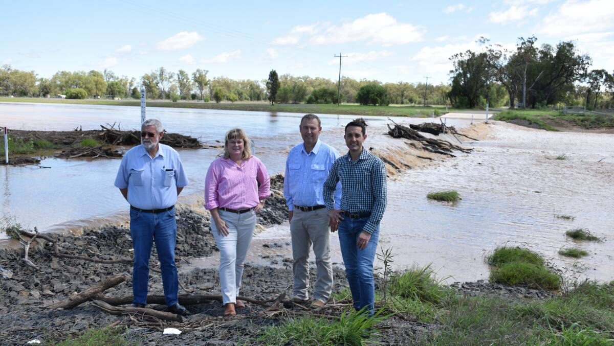 Maranoa deputy mayor Geoff McMullen, Warrego MP Ann Leahy, Maranoa mayor Tyson Golder and opposition leader David Crisafulli inspecting the floodwater pouring through the eastern diversion channel at Roma. Picture supplied.