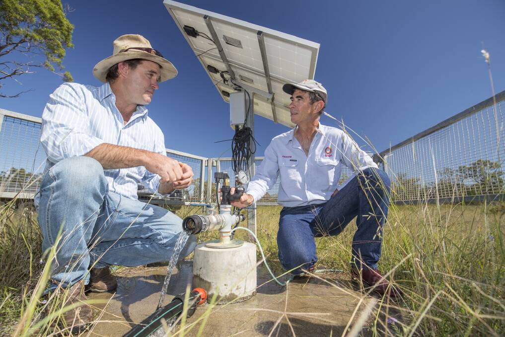Millmerran's Craig Antonio discusses bore monitoring with Andrew Moser from Origin Energy. Photo - Queensland Murray Darling Committee.
