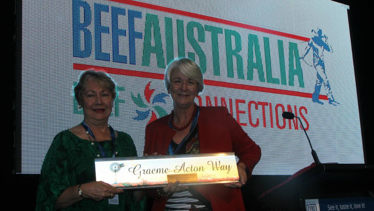 Jennie Acton receives the street sign presented by Rockhampton Regional Council mayor, Margaret Strelow, at the Graeme Acton Beef Connections luncheon.