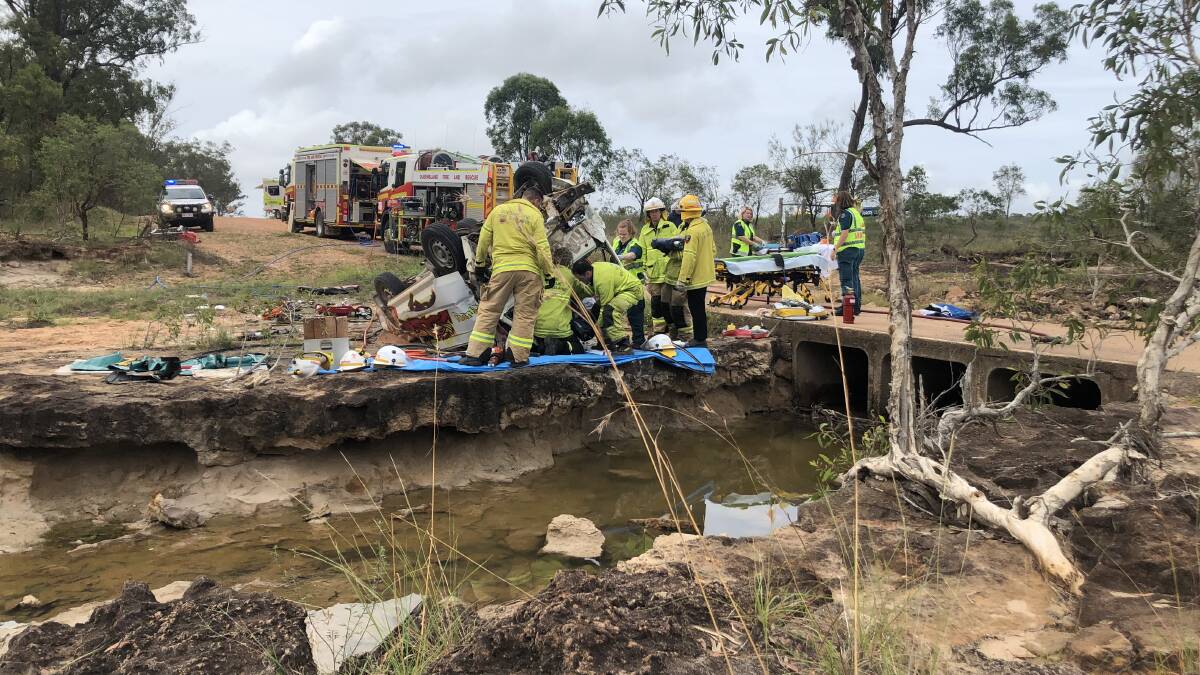 The RACQ Capricorn Rescue team on the scene at the accident site, along with QFES and Queensland Ambulance members. Picture supplied.