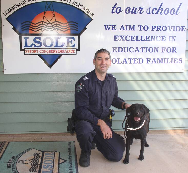 Senior Constable Cam O'Sullivan and PD Violet educated some of the students at the Longreach School of Distance Education recently.