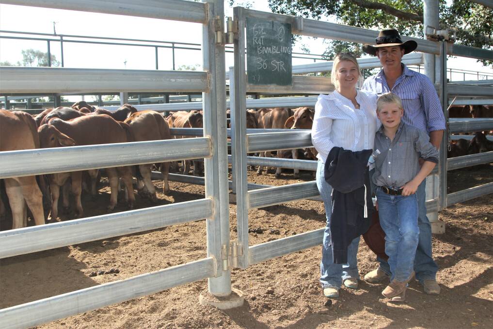 Payday: Tiffany, Ross and Mason Bambling were overjoyed with the price received for their first lot of cattle for sale at Blackall on Thursday. Picture: Sally Gall.