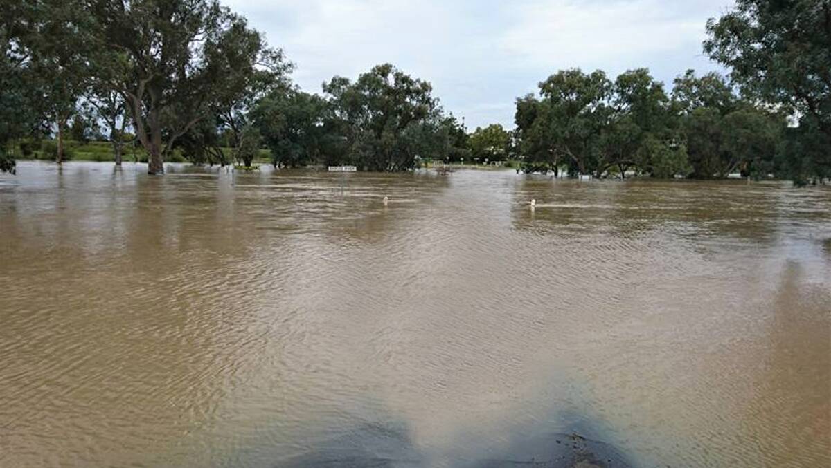 Untenable: With the current bridge at Tambo, floods have cut the town, in the background, off from its airstrip plus properties to the north, Alpha and Springsure. Photo: Sally Gall.