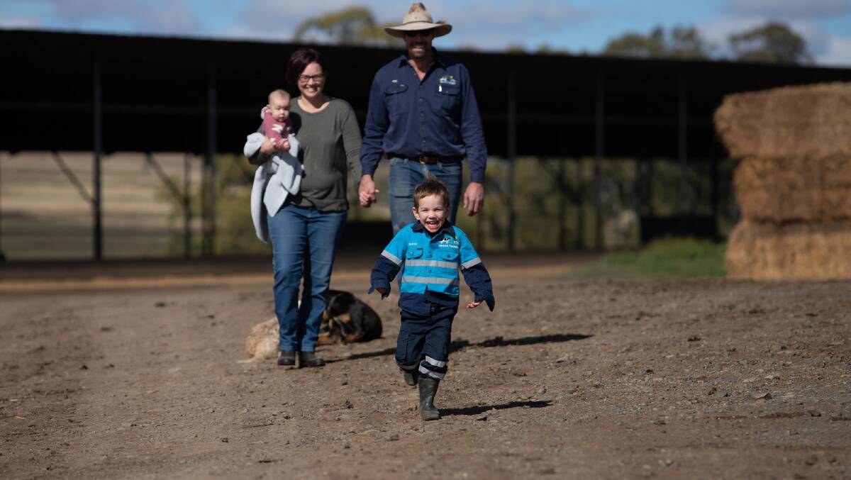 INNOVATION: Queensland dairy farmers Peter and Jess Garratt and their children on their Darling Downs property, where they will install a grain batching system.
