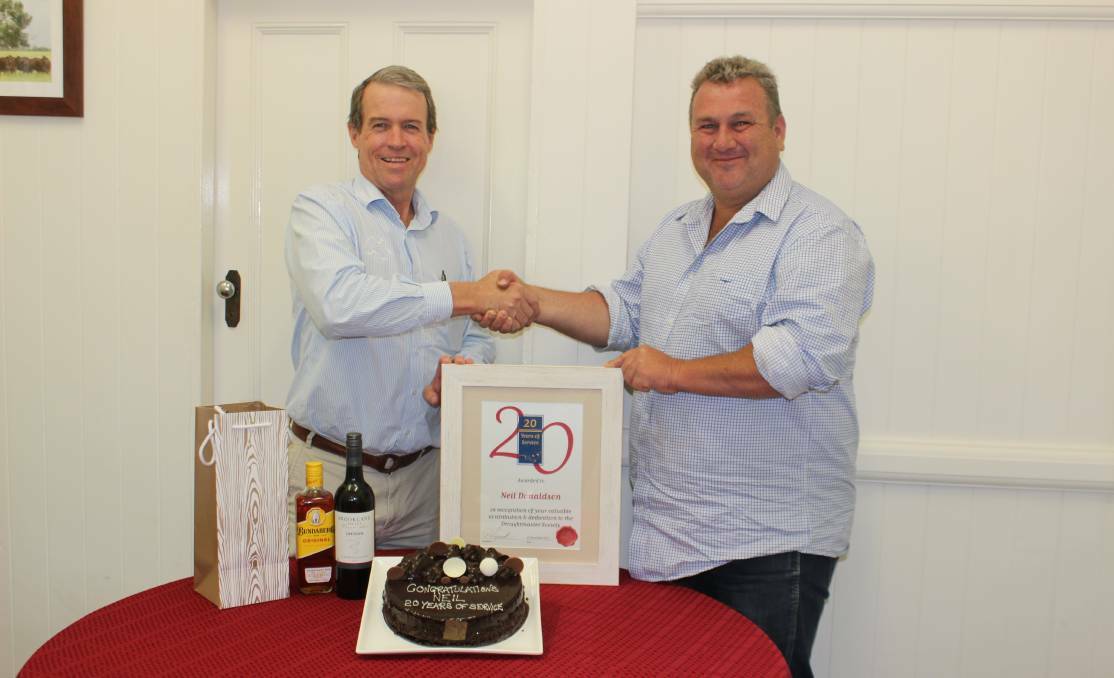 Former Droughtmaster Australia Society CEO, Neil Donaldson with former president Paul Laycock, during a celebration for Neils 20 years of service in 2017. Photo by Sharon Harms. 