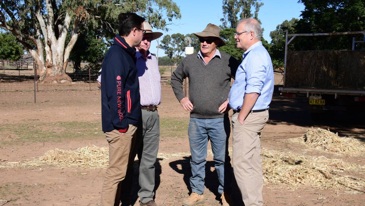 LISTENING AND LEARNING: Agriculture Minister David Littleproud, Parkes MP Mark Coulton, Kevin West and Prime Minister Scott Morrison discuss the impacts of drought. Photo: BELINDA TOOLE