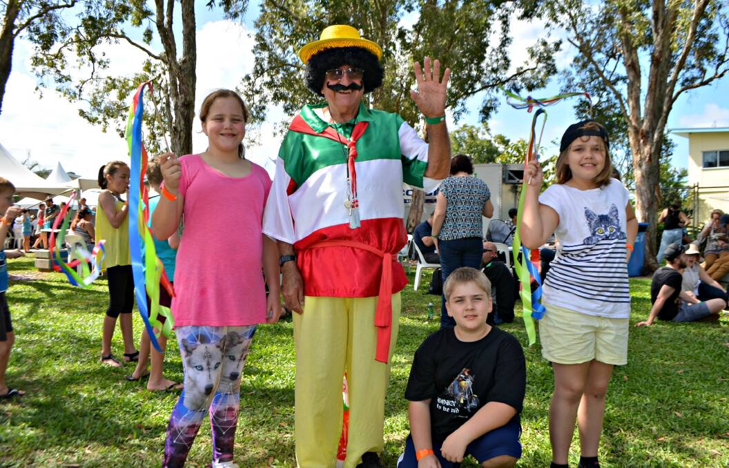 CIAO: There are always plenty of colourful characters at Ingham's Australian Italian Festival, as Grace Finnigan and Caleb and Gemma Harbort from Townsville discover, meeting festival mascot Luigi (aka Graham Cockrell).