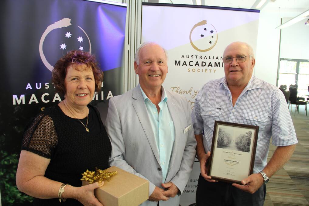 AWARDED: Qld macadamia growers, Julie and Gary Davis, Donnybrook are presented the 2019 Australian Macadamia Grower of the Year award from Australian Macadamia Society chairman, Richard Doggett. 
