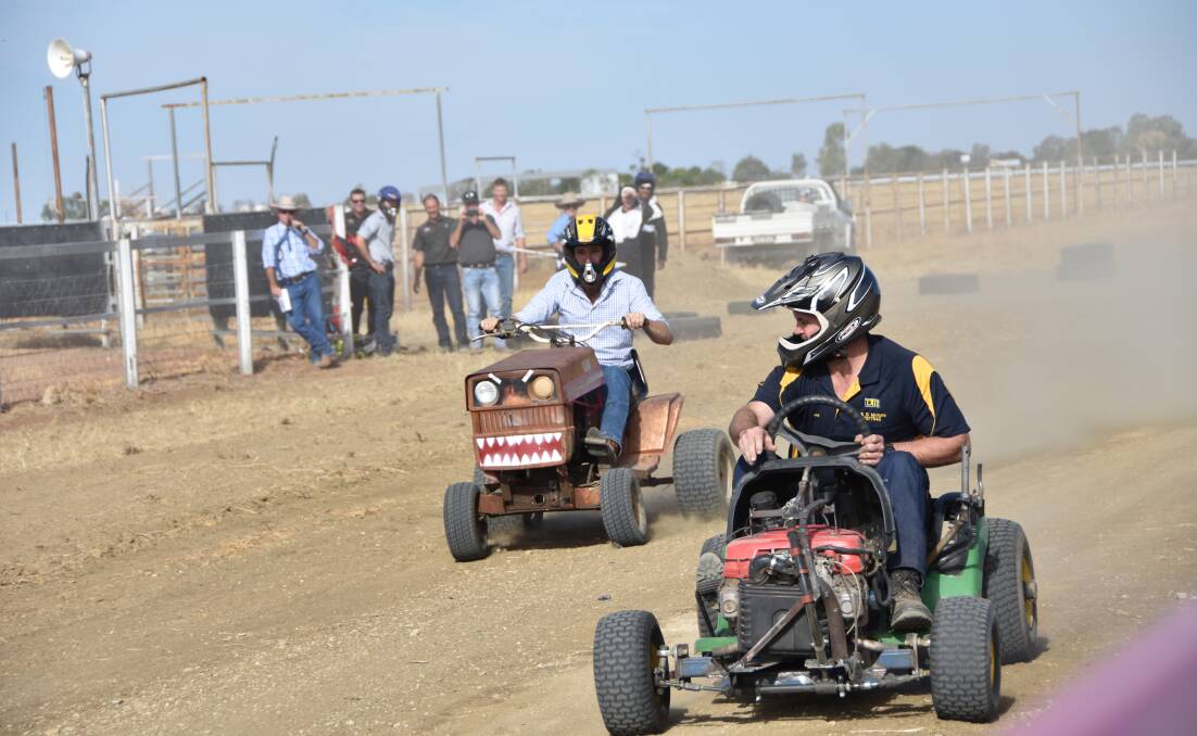 REVVED: Competitors at last year's Mower Derby put the foot down in hopes of securing some prize money. 
