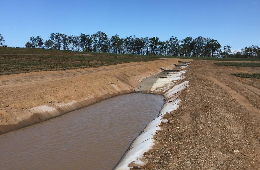 CATCHING: Geo-fabric lined drain integrated with gabion basket weirs and sediment traps.
