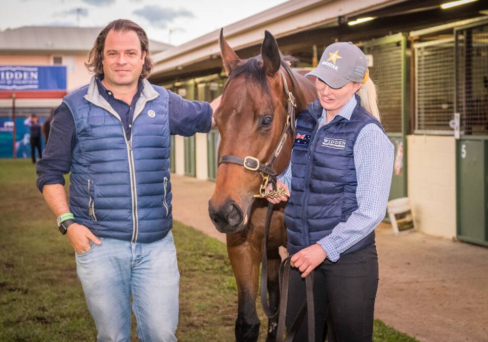 Coolmore Stud principal Tom Magnier paid the all-time Magic Millions auction record price of $4.2 million for champion mare Sunlight held by her long-time strapper and track rider Sarah Rutten. Picture: Magic Millions