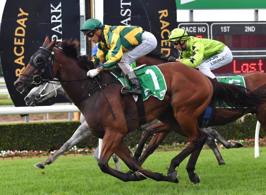 Jockey Jag Guthmann-Chester (left) rides Allround-Glory to victory in the McCain Foods Handicap at Aquis Park on the Gold Coast on Saturday. (AAP Image/Darren England)