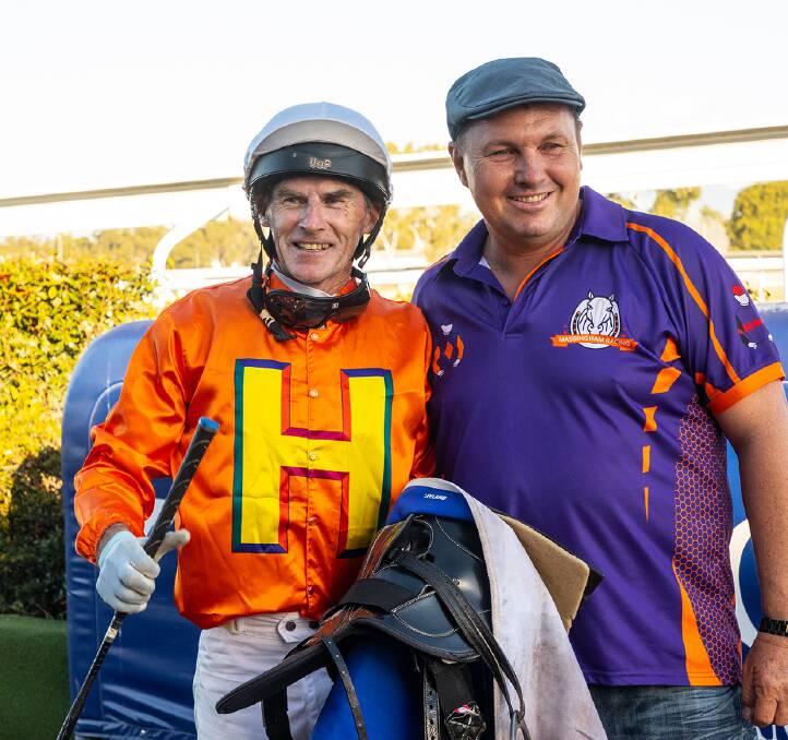 All smiles after winning the Townsville Cup with The Harrovian were jockey Robert Thompson and trainer Stephen Massingham. Picture - Mike Mills
