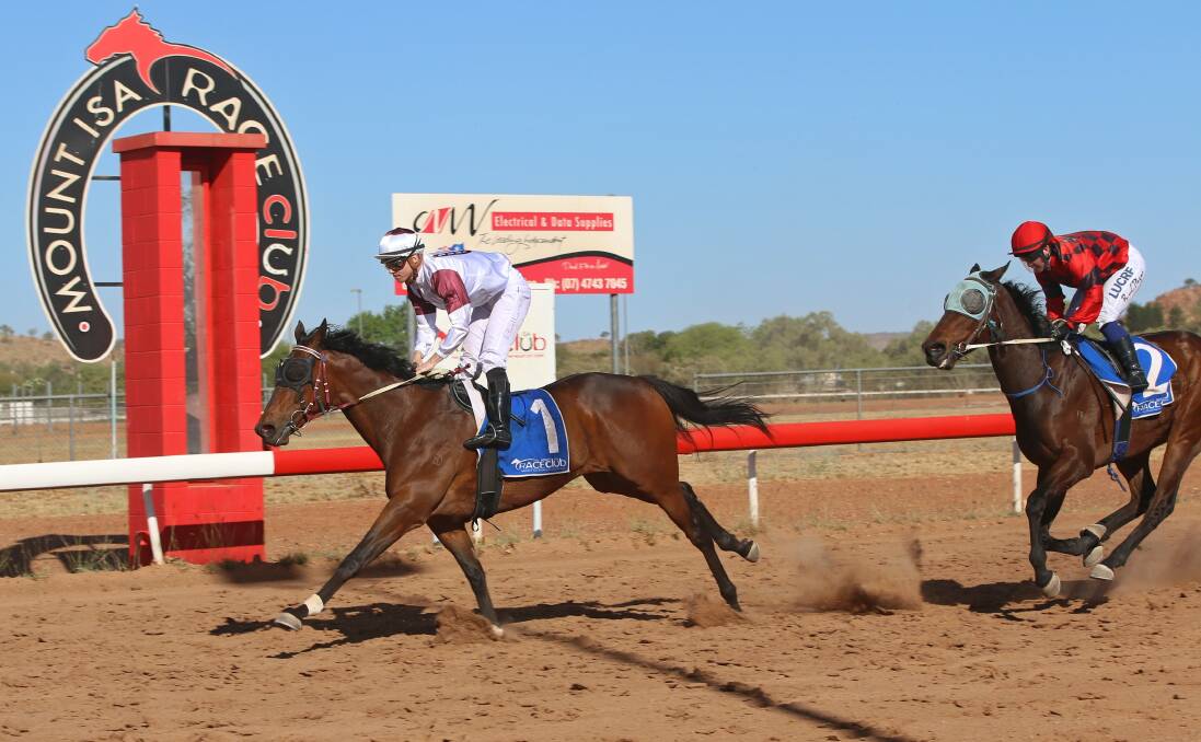 Dan Ballard leads Deadly Choices to victory in the Mount Isa Spring Cup. Picture: Sharon Crossland