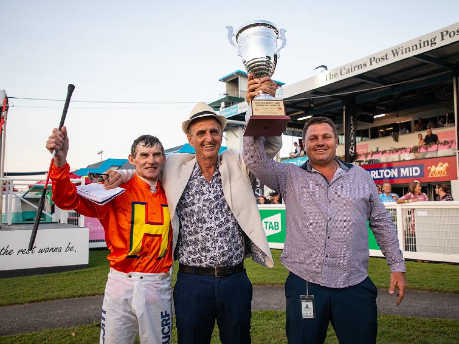 
Successful winning trio (from left) jockey Robert Thompson, Cairns Jockey Club president Tom Hedley (owner) and Stephen Massingham (trainer) after The Harrovian won the Cairns Cup. Picture: Mike Mills