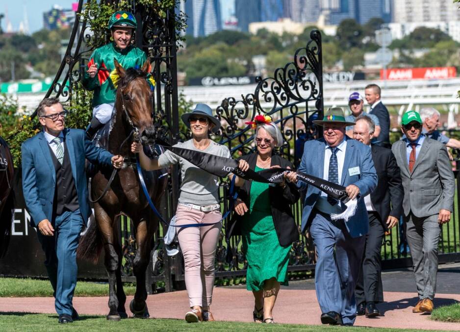Sunshine Coast-based galloper Alligator Blood ridden by Ryan Maloney with trainer David Vandyke (left) and connections after winning the Group 1 Australian Guineas at Flemington. Picture: Magic Millions