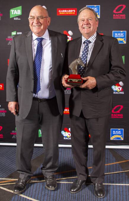 Eureka stud-master Scott McAlpine (right) with Queensland champion sire trophy won by Spirit Of Boom presented by Thoroughbred Breeders Queensland Association president Basil Nolan. Picture: Racing Queensland
