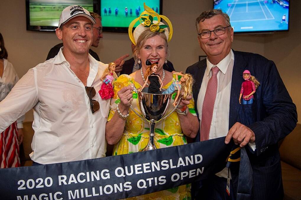 Brisbane trainer Tony Gollan (left) and Central Queensland graziers Jennifer and Alan Acton, Wilpeena, Dingo, with the Cup and Sash after the Actons' 4YO mare Outback Barbie won the Magic Millions QTIS Open. Picture: Magic Millions