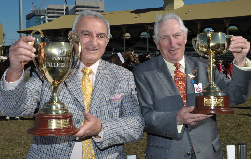 A feature of Thoroughbred judging at the 2012 Brisbane Royal Show was the display of the 1997 Melbourne and Caulfield Cups won by Might And Power raced by Sydney-based Nick Moraitis. Pictured (from left) are Nick's brother Paul Moraitis, Brisbane (holding Caulfield Cup) and Irish judge Robert McCarthy (Melbourne Cup).
