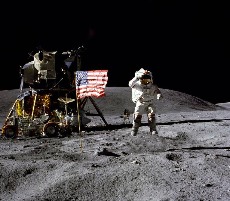 In this April 1972 photo made available by NASA, John Young salutes the U.S. flag at the Descartes landing site on the moon.