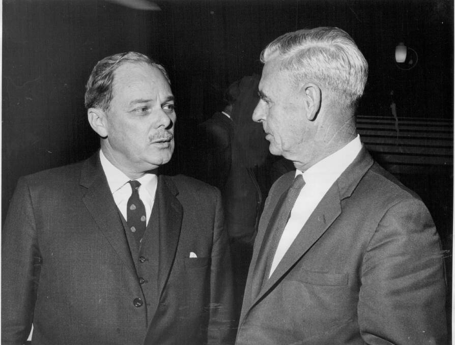TALKING WOOL: Chairman of the National Council of Wool Selling Brokers, Anthony Dunstan, talks with the president of the Australian Wool and Meat Producers Federation, R.V. Sewell, in 1968. 
