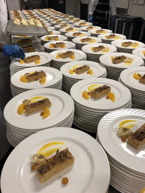 NEW WAYS: Hundreds of desserts topped with lamb floss were plated up for the large crowd at the AWI GrandsLamb dinner at LambEx in August.