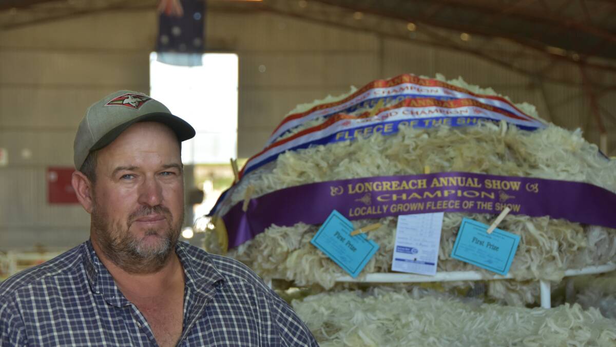Jon Karger in front of his prize winning fleece.