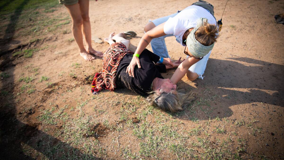 Protesters rushed to check on the woman, who was seriously injured in the incident. Photo: Matthew Newton.