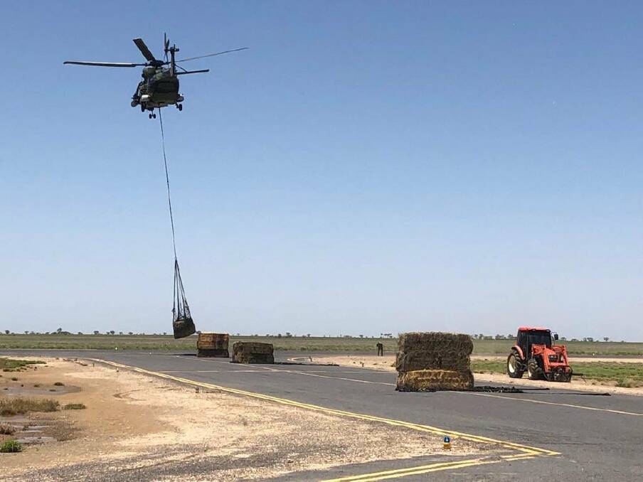 An Australian Defence Force Taipan helicopter moves fodder out of Julia Creek. PHOTO: Australian Defence Force. 