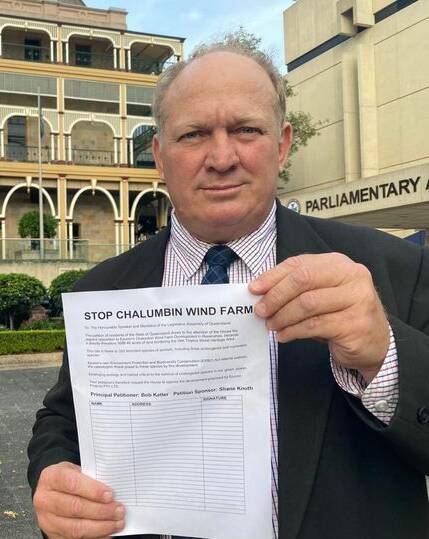 KAP local member for Hill Shane Knuth pictured outside of State Parliment House in Brisbane, holding a 'Stop Chalumbin Wind Farm' petition paper. Picture: Supplied. 