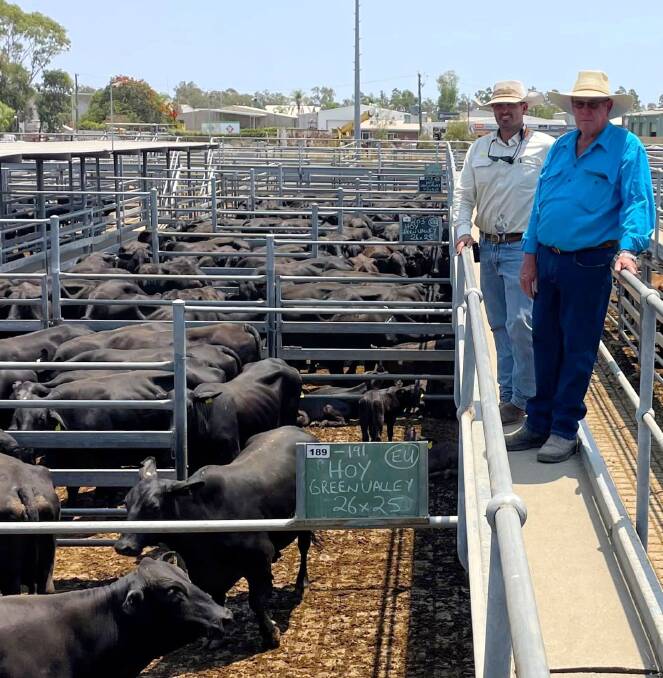 Brock Palmer, Emerald Land and Cattle Company (Livestock) Pty Ltd, and Colin Hoy, formerly of Green Valley, Bogantungan, who sold Brangus cows and calves to top at $1460/unit. Picture supplied. 