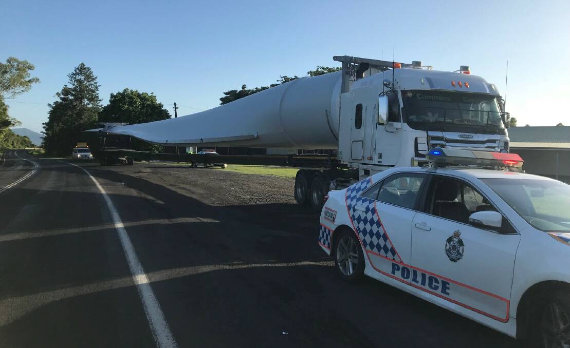 Police escort a wide load carrier. Photo: Qld Police