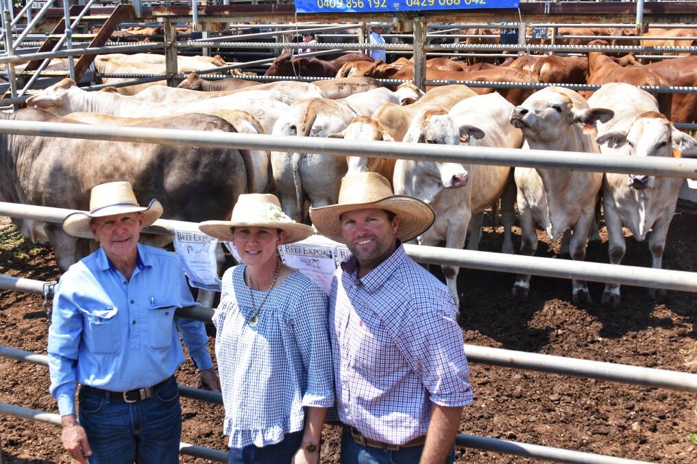 Frank, Natalie and Scott Finger of Hillview Cattle Co, Clermont, with their grand champion exhibit pen of Simmental Brahman cross bullocks. Pictures: Ben Harden 