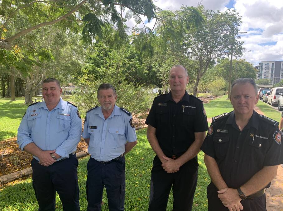 Queensland emergency servicemen: Eddie Cowie, SES, Barry Thompson, FRS, Patrick Downing, Area Controller Capricornia, and Brett Williams, FRS, gather near the banks of the Fitzroy River in Rockhampton, 10 years since the catsatrophic rainfall events in Queensland's history. Photo: Ben Harden