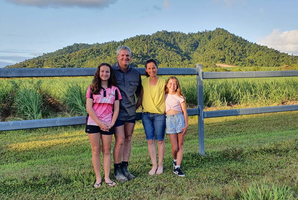 OPTIMAL YEILD ABOUND: Chris and Kelly OKane with their daughters Grace and Brydie at their Tully cane property. .