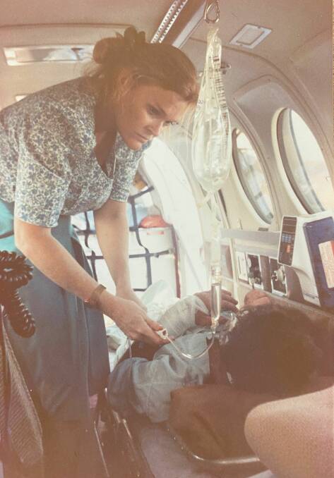 Susan Markwell attending to a patient at Cape York in the early 1990s. Picture: RFDS 