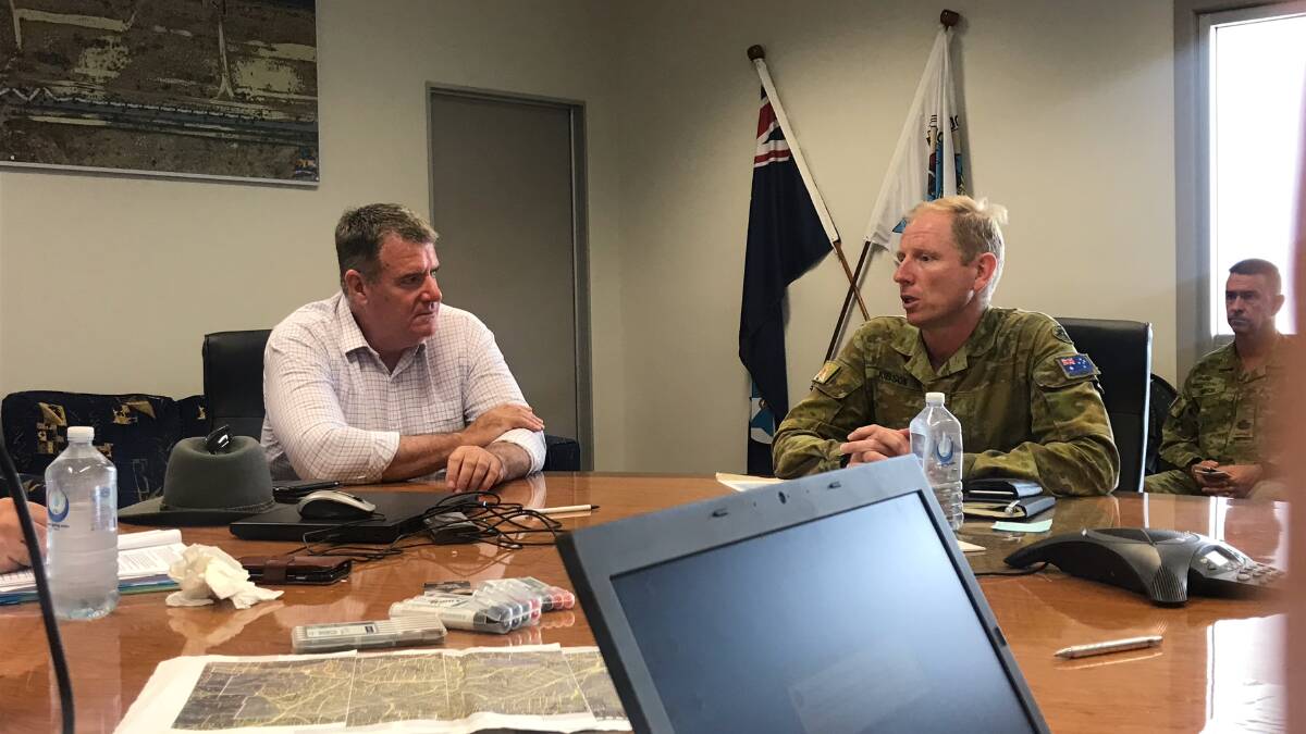 Minister Furner meeting with Australian Defence Force representatives in Julia Creek in the wake of the monsoon event early this year.