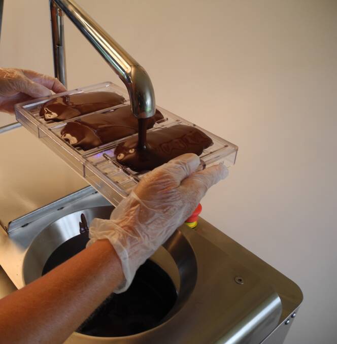 Chocolate is poured into the block mold.